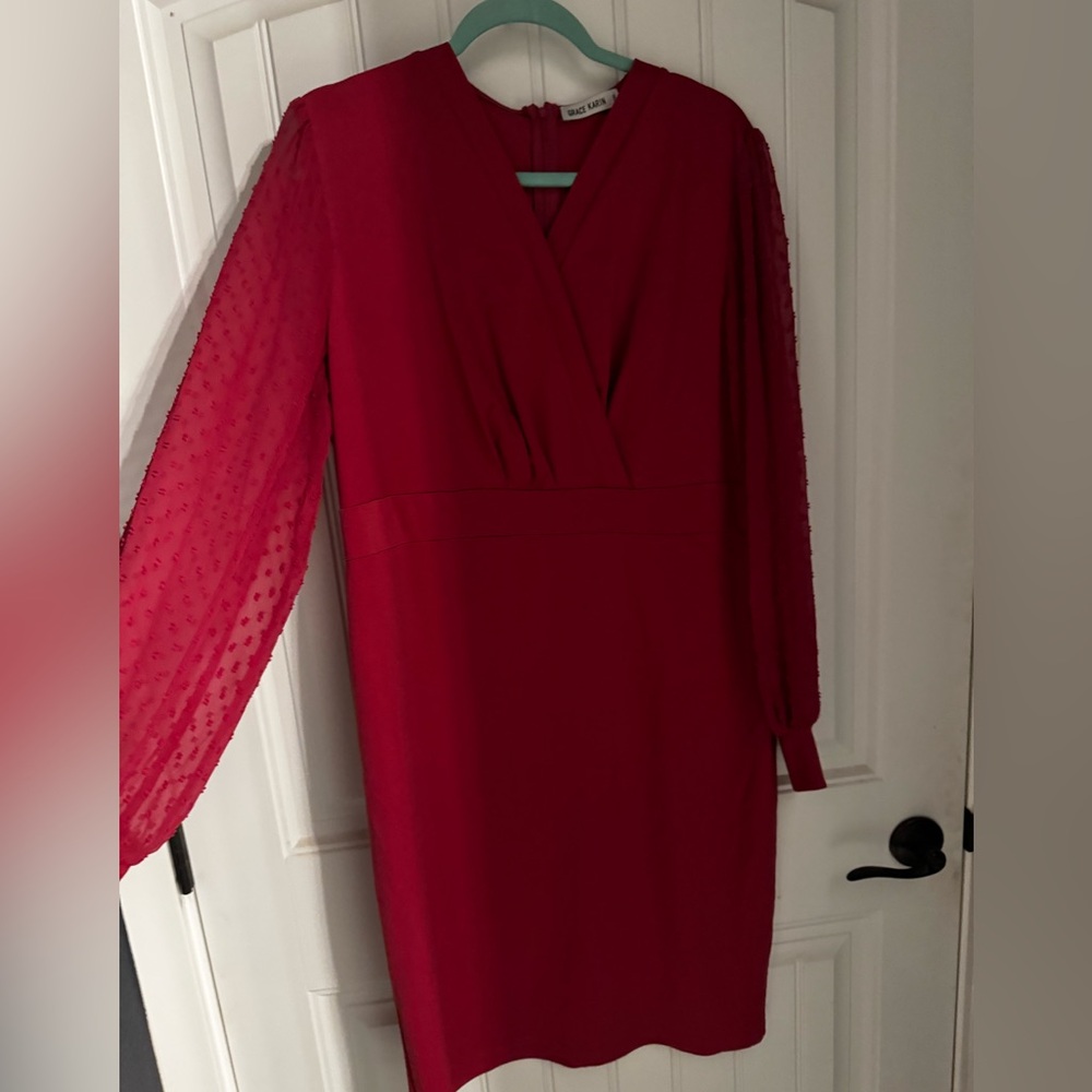 Pink sheath dress with Swiss dot sleeves.